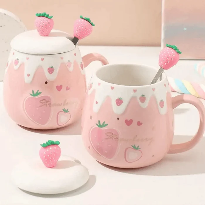 Pink ceramic mug with white lid and spoon, hand-painted strawberry heart design
