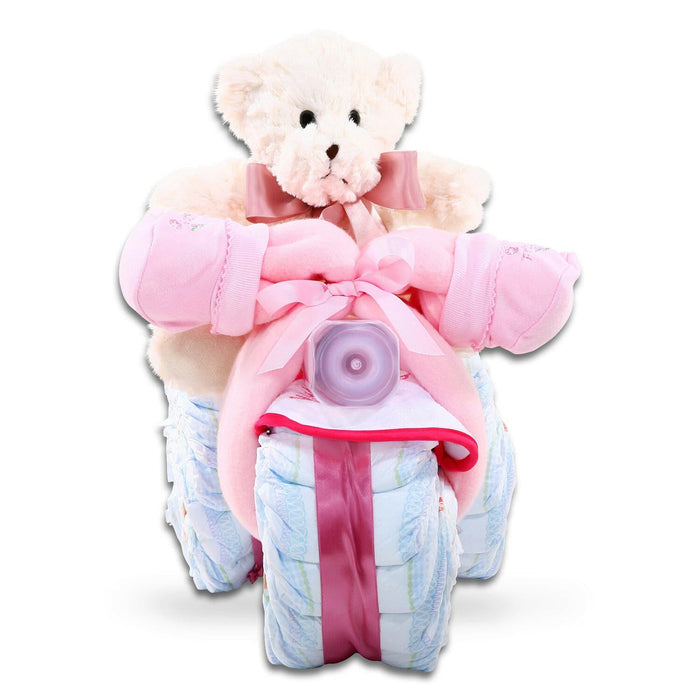 Pink tricycle diaper cake gift basket with bear top, pink bow, blue diaper wrap