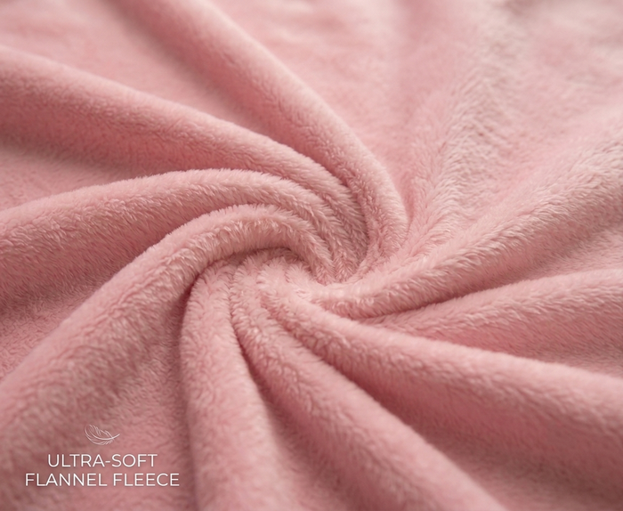 Pink ultra-soft flannel fleece blanket fabric, close-up plush texture