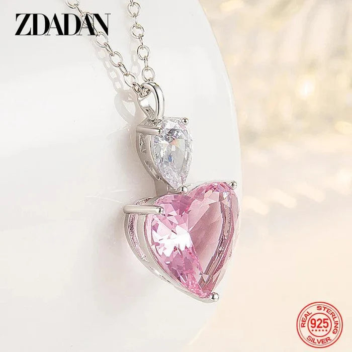 Silver pendant necklace with pink heart zircon and clear zircon detail above