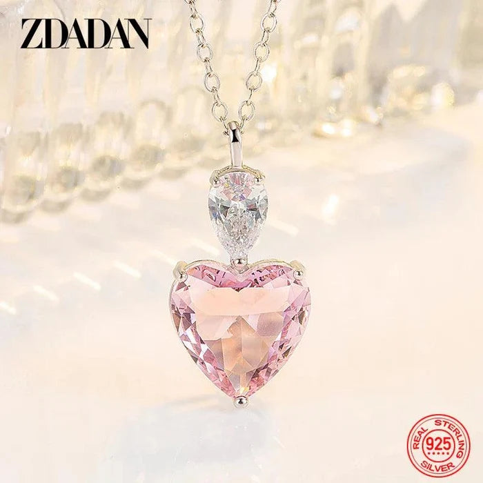 Silver heart pendant necklace with pink zircon heart and clear oval zircon drop
