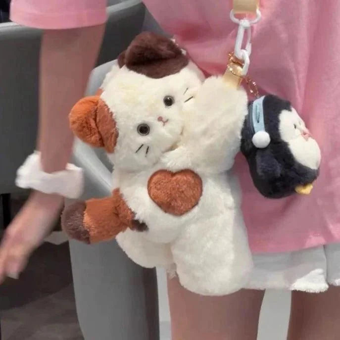 Plush crossbody bag with white cat face, brown ears, heart patch, chain strap