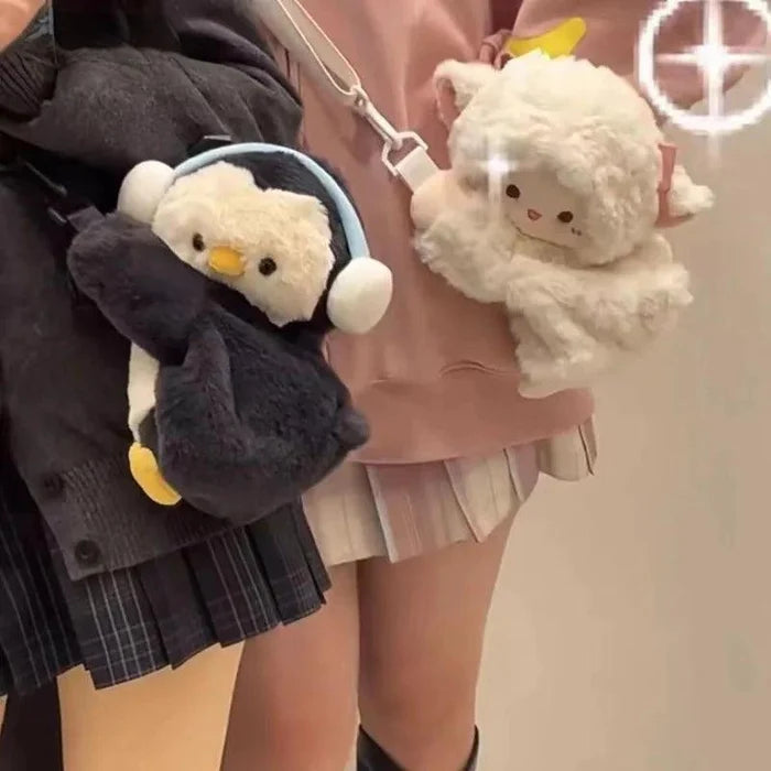Cream plush lamb crossbody bag with white strap and embroidered face on display