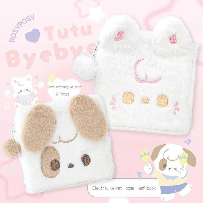 White plush cat notebook with embroidered smile, button eyes, and dangling pom charm