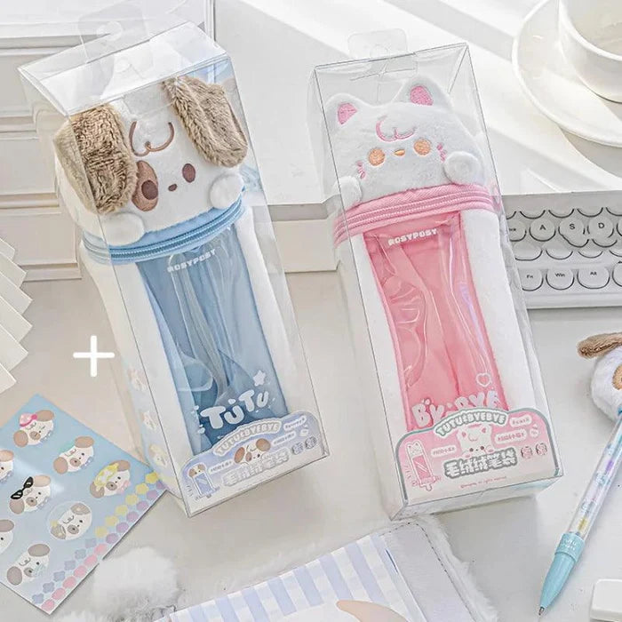 Plush puppy and cat pencil bags in clear boxes with white plush faces