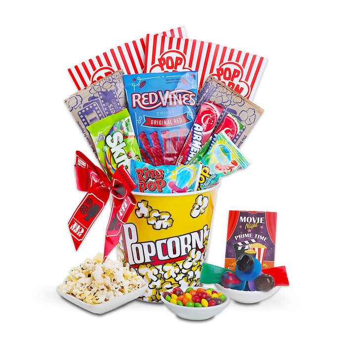 Movie night gift basket with popcorn tub, candy packs, and snack bowls