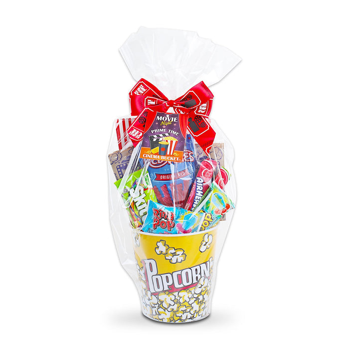 Wrapped movie night gift basket in clear bag with red ribbon bow