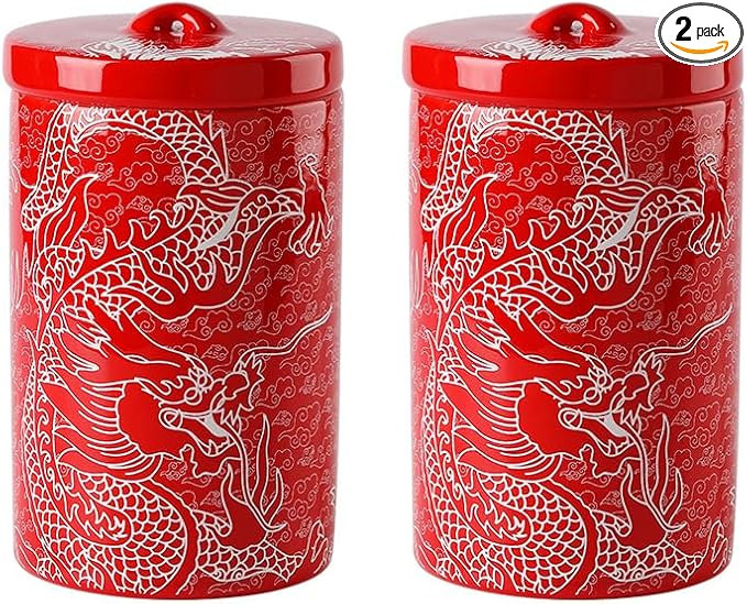 Pair of red porcelain storage canisters with matching lids and white dragon pattern