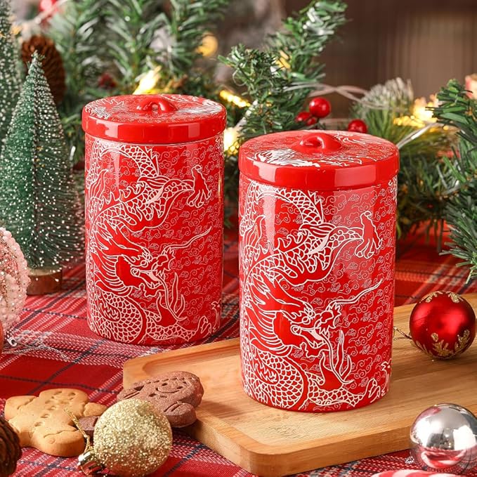Two red porcelain canisters with white dragon motif and round lids