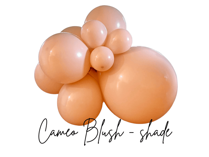 Peach orange latex balloon cluster with five round balloons in cameo blush shade