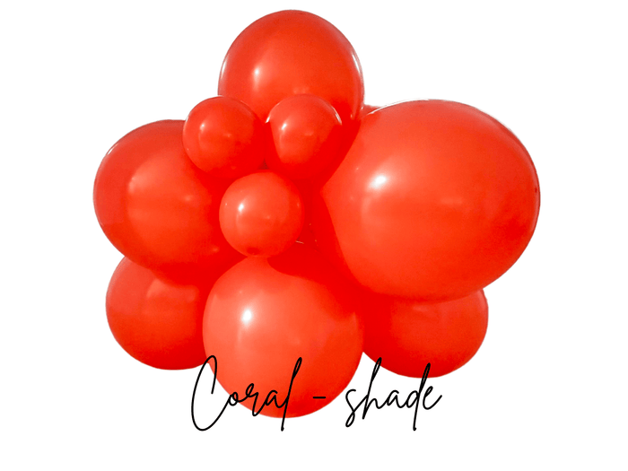Coral latex balloon cluster, close-up view of glossy balloon arrangement