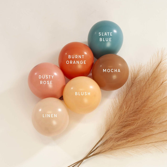Assorted latex balloon cluster with dusty rose, burnt orange, slate blue, and mocha balloons