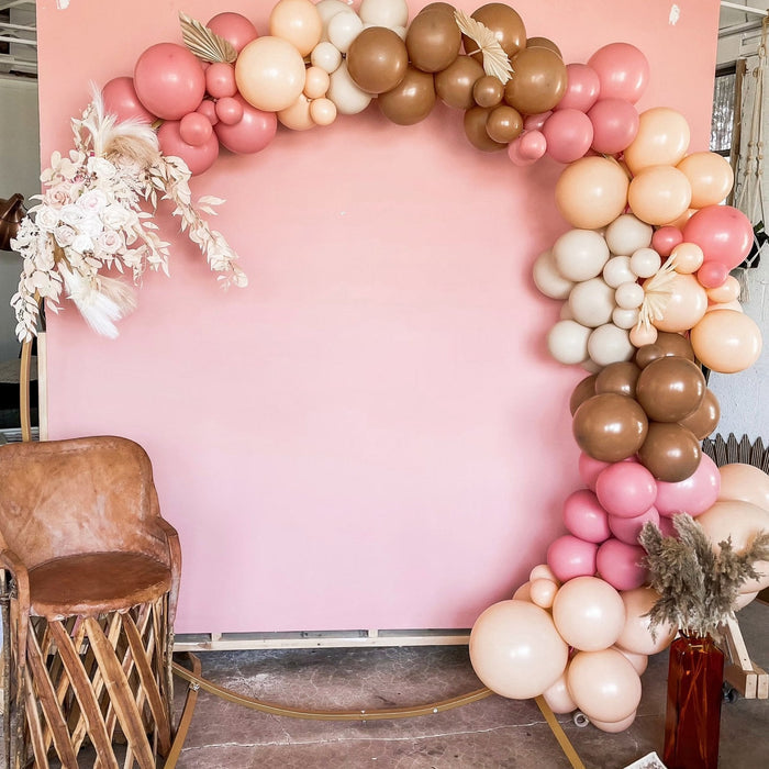 Balloon frame backdrop with pink, blush, and metallic brown latex balloons