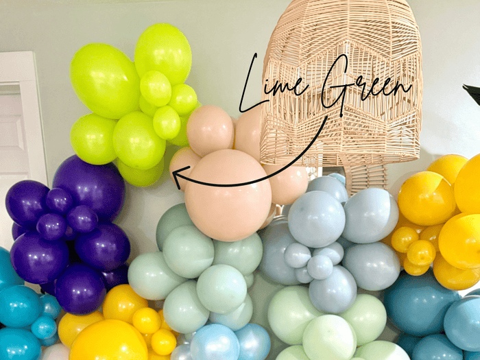 Multi-color latex balloon cluster with lime green balloons among pastel balloons