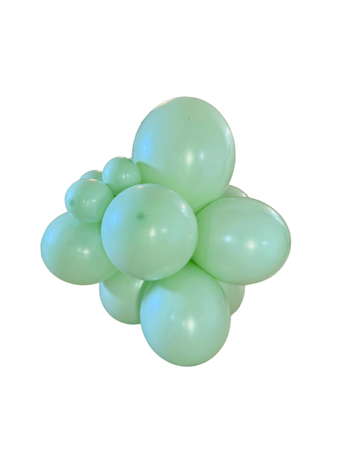 Pastel green latex balloon cluster with multiple glossy balloons tied together