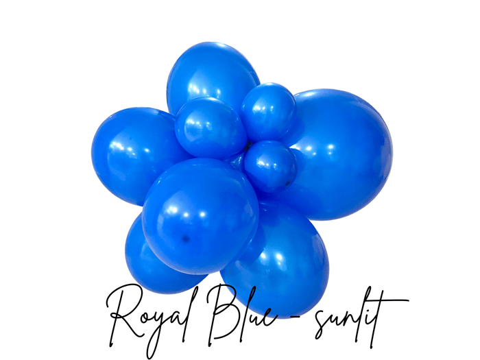 Royal blue latex balloon cluster with glossy balloon spheres, close-up view