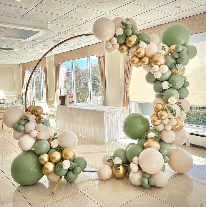 Balloon arch with sage green latex balloons and mixed cream and gold balloons