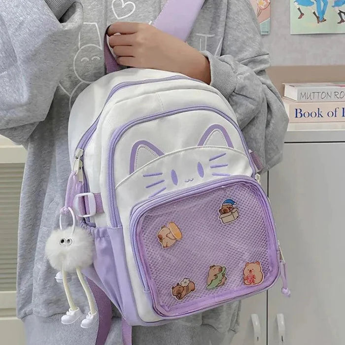 Lavender school backpack worn with front cat face and mesh pocket, adjustable straps