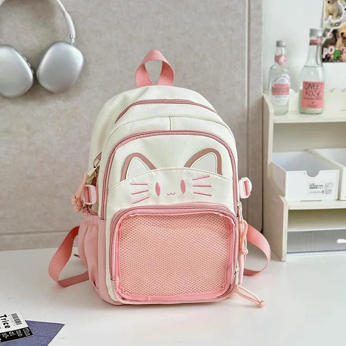 Pink ita-style school backpack front view with cat-face design and mesh pocket