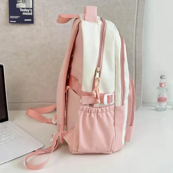 Pink and cream school backpack with side pocket and top handle, adjustable shoulder straps