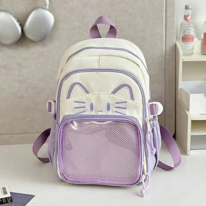 Purple ita-style school backpack with cat-face front and mesh pocket