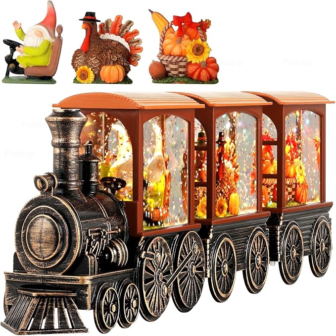 Orange-and-black steam train snow globe with glittering LED light panels and candle lantern body