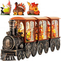 Orange-and-black steam train snow globe with glittering LED light panels and candle lantern body
