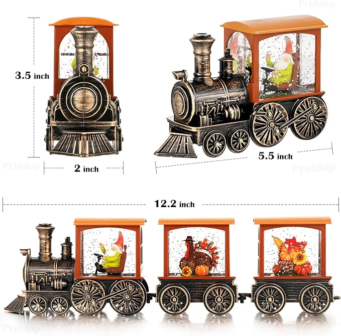 Steam train snow globe with orange top and black body, shown with size measurements