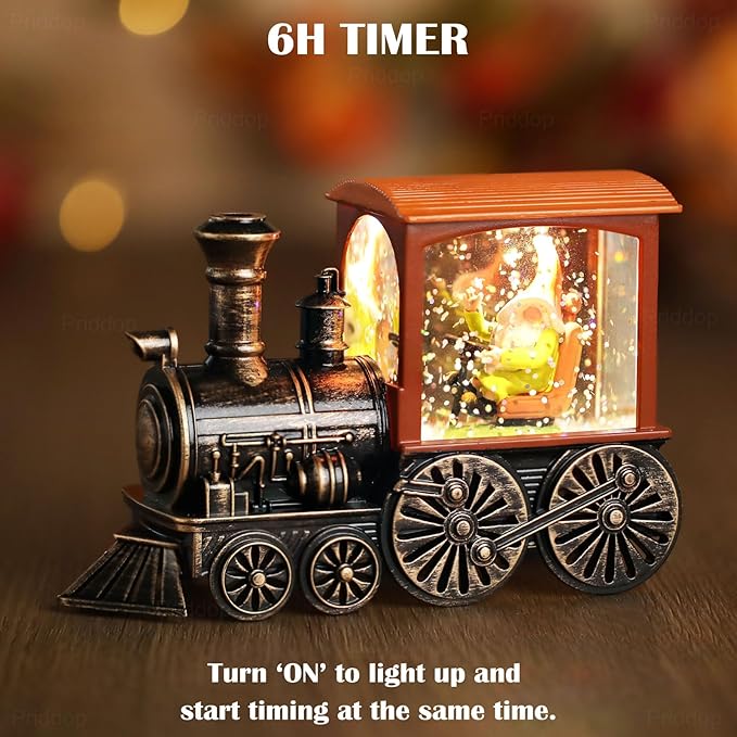LED-lit train snow globe with orange cabin and black wheels, glowing window with glitter