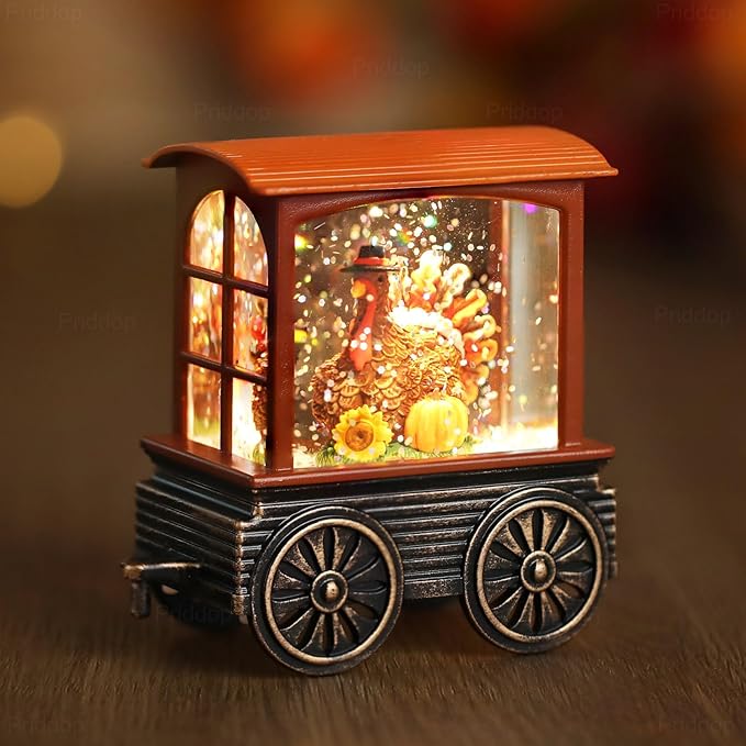 Close-up of orange-roof train snow globe with glowing glass window and glittering interior