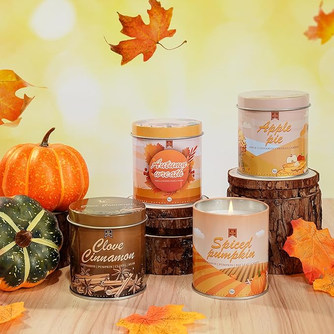 Set of autumn scented candles; one jar reads Spiced Pumpkin with visible wax and wick