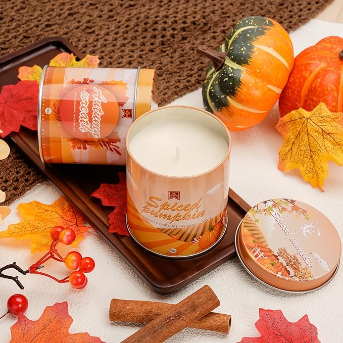 Pumpkin spice candle jar with matching lid, cinnamon sticks on a tabletop