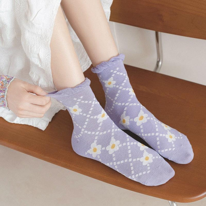 Lavender daisy lattice socks worn with ruffled cuff, crew length