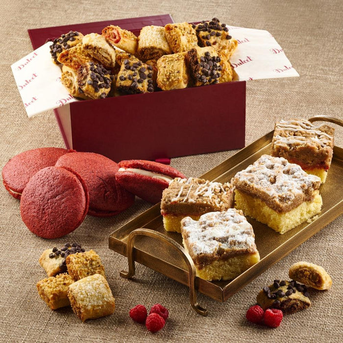 Assorted pastries in a red gift box with cakes and crumb bites