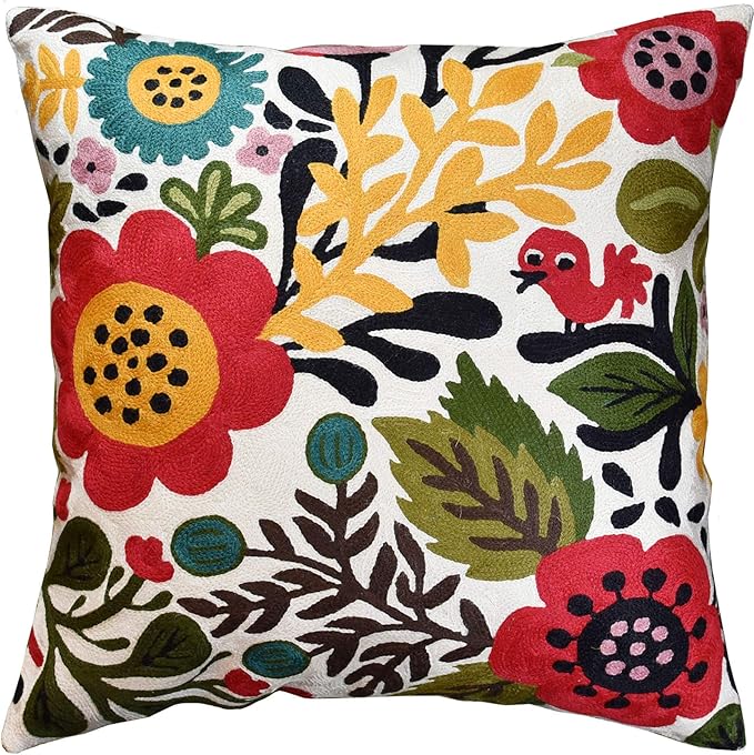 Floral bird pillow cover in red, yellow, teal, and green on white fabric.