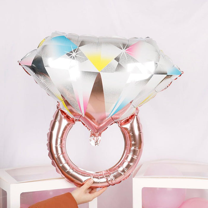 Rose gold ring-shaped balloon with faceted multicolor heart design, foil shine