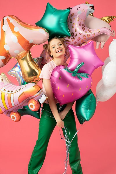 Roller skate balloon with pink and gold stripes, orange wheels, and star detail