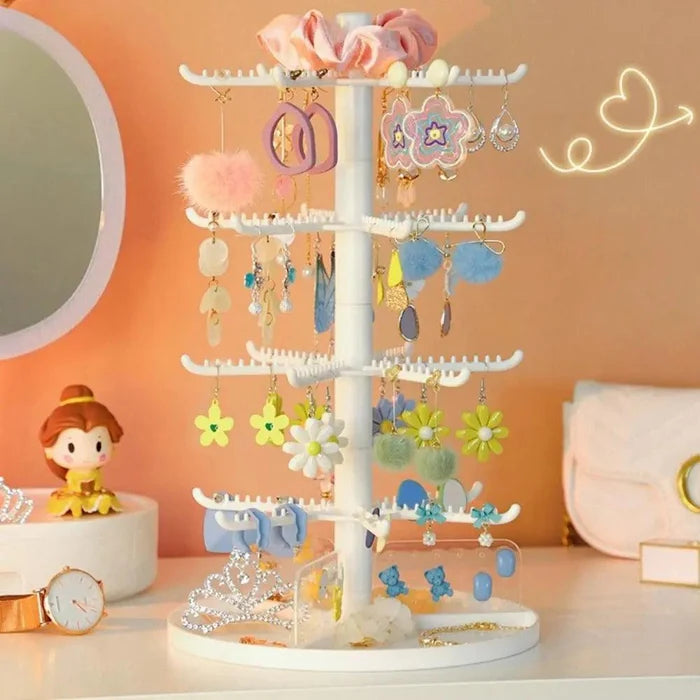 White rotating earring display stand with three tiers of curved hook arms
