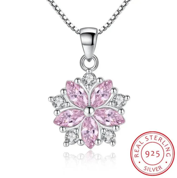Silver-toned cherry blossom pendant necklace with pink center stone and Real Sterling 925 seal