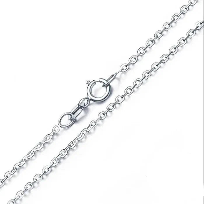 Silver chain necklace with link detail and clasp hardware, close-up