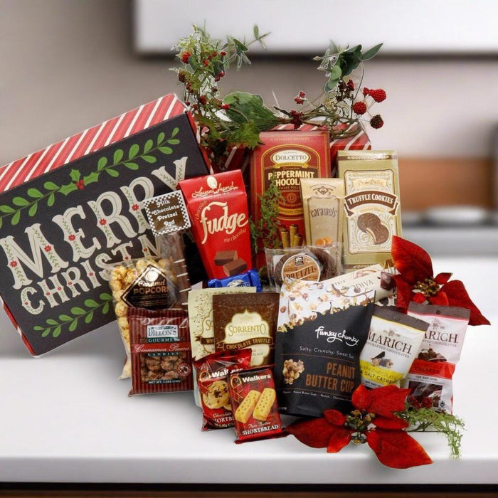 Large Christmas candy gift box with assorted wrapped chocolates and festive greenery