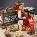 Christmas gift box filled with assorted chocolates and sweets, open with red bow decor