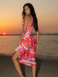 Model wearing the Selene swimsuit and sarong in Dolce Vita print by NAIA Beach