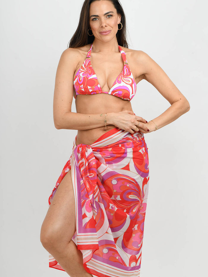 Model wearing the Maia Bikini and sarong in Dolce Vita print by NAIA Beach