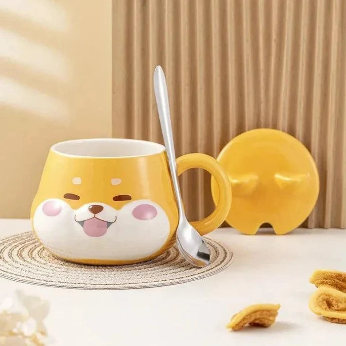 Yellow dog-face mug with spoon and lid propped beside it on a round coaster