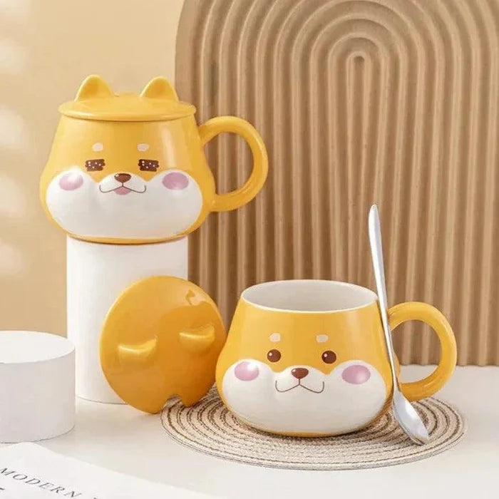 Yellow dog-face mug with lid and handle, with lid partially open and spoon nearby