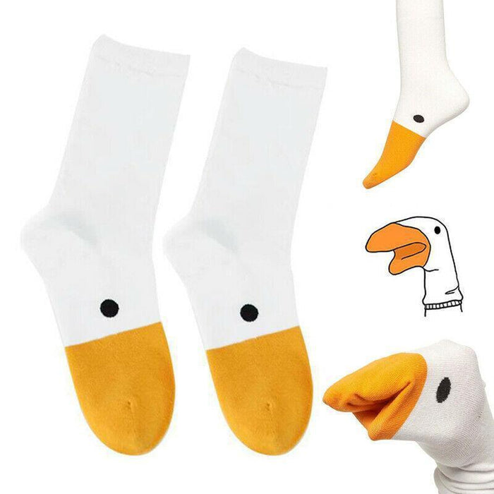 White socks with orange cuffs and toe, black dot on ankle, penguin graphic on side