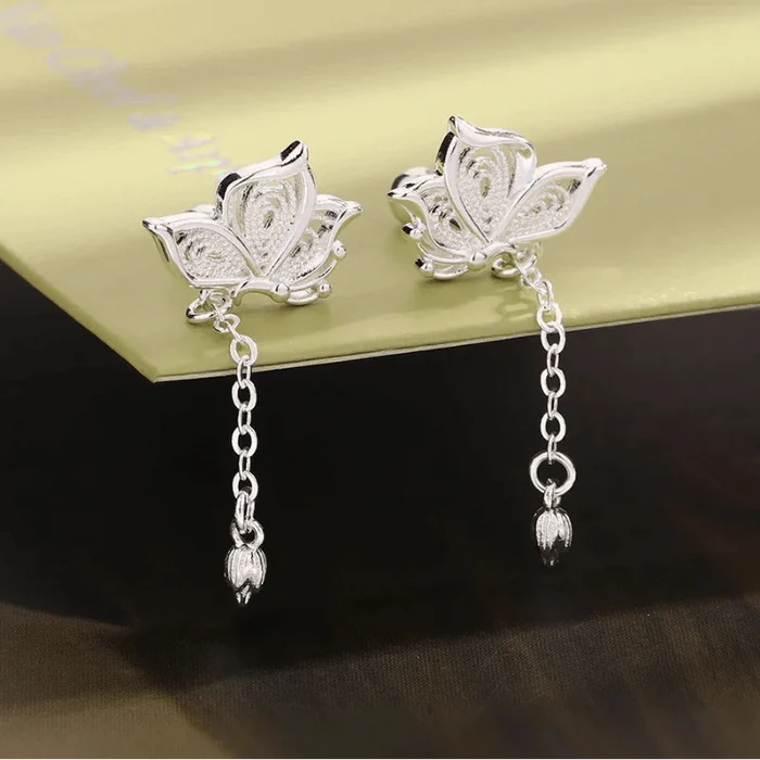 Silver butterfly stud earrings with dangling chain and small teardrop dangles
