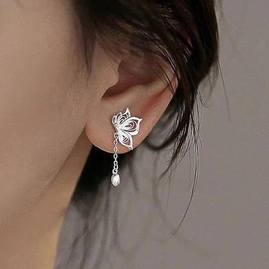 Silver butterfly stud earring with dangling chain and teardrop charm