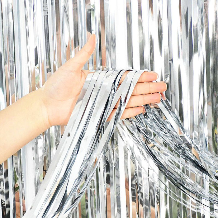 Silver metallic fringe curtain backdrop, shiny strips with hand-held edge